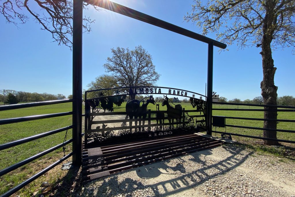 horse ranch gate with overhang bar - iron fencing