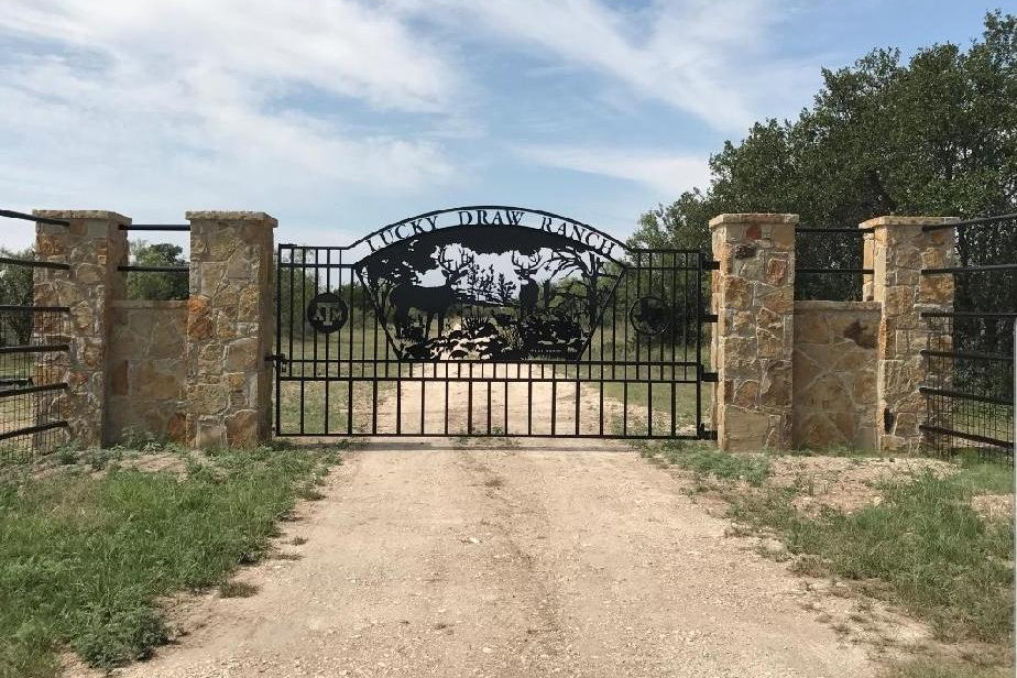 ATM, A&M gate, metal artwork, ranch gate with stone details