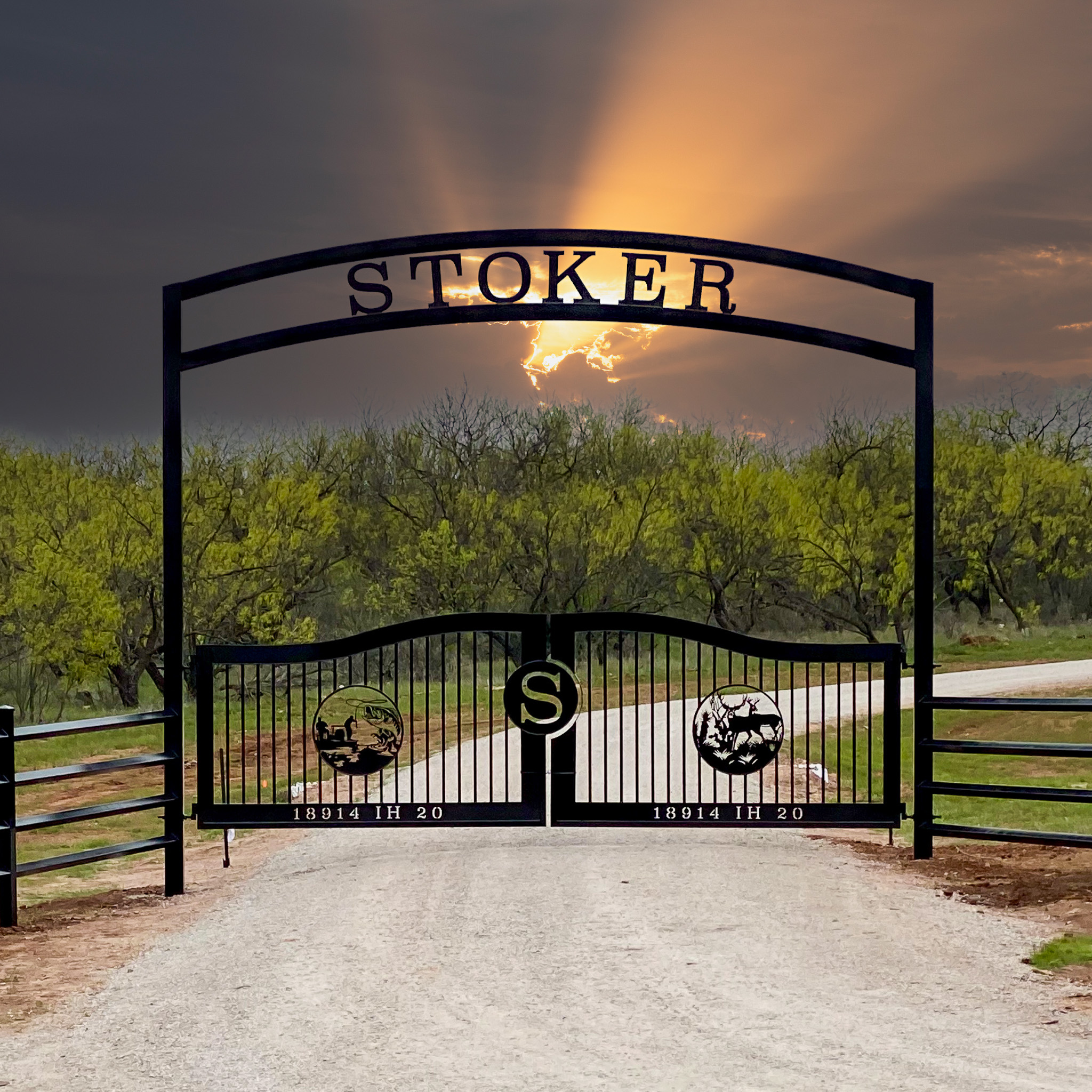 Stoker written above a ranch gate with bass on left side and a deer on the right side of the gate