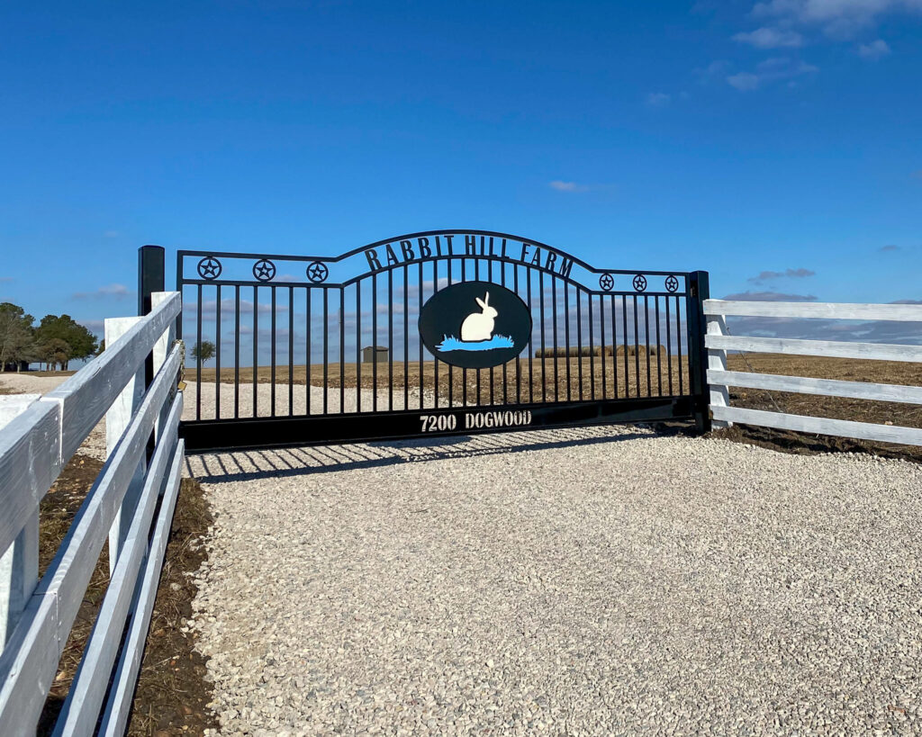 Swing gate with rabbit design in the center.