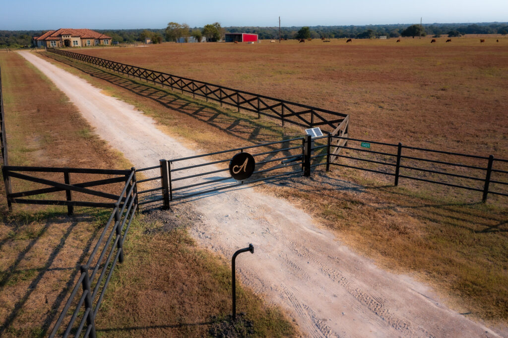 Custom letter A in center of pipe gate entrance for a ranch